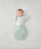 Newborn wearing an ergoPouch Butterfly Cardi Grey Marle with arms in