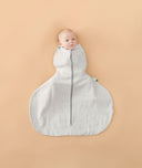 Newborn being swaddled in ergoPouch Hip Harness Cocoon Swaddle Sack 1.0 TOG Grey Marle
