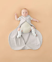 Newborn in ergoPouch Hip Harness Cocoon Swaddle Sack 1.0 TOG Grey Marle, with legs open from hip dysplasia