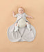 Newborn in ergoPouch Hip Harness Cocoon Swaddle Sack 1.0 TOG Grey Marle, with legs open from hip dysplasia