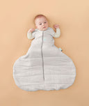 Baby sleeping with arms out in a ergoPouch Hip Harness Cocoon Swaddle Sack 2.5 TOG Grey Marle