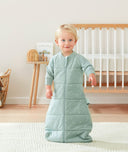 Toddler wearing ergoPouch Sleep Sack in Sage