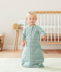 Toddler wearing ergoPouch Sleep Sack in Sage