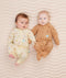 Two newborns wearing  ergoPouch Long Sleeve Romper 0.2 TOG Critters and Honey Bees