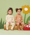 Smiling infants wearing  ergoPouch Long Sleeve Romper 0.2 TOG Critters and Honey Bees