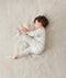 Infant wearing ergoPouch Long Sleeve Romper 1.0 TOG Grey Marle
