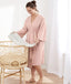 Woman smiling wearing an ergoPouch Matchy Matchy Robe Berries