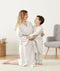 Mom embracing her toddler wearing an ergoPouch Matchy Matchy Robe Grey Marle