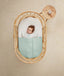 ergoPouch Drift Away White Noise Machine Taupe on table near cot
