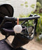 ergoPouch Drift Away White Noise Machine Taupe hanging from pram handle bar