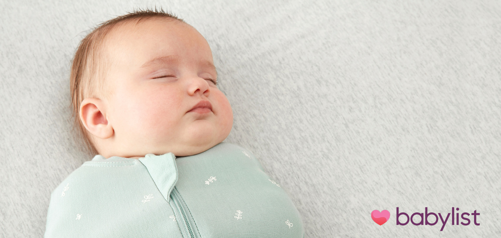 Baby sleeping in an ergoPouch Cocoon Swaddle Bag, a baby registry must-have