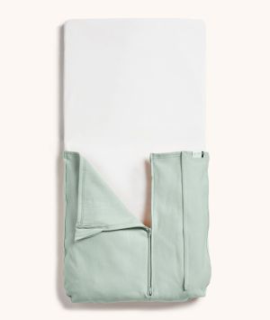 ergoPouch Baby Tuck Sheet in Sage, partially zipped